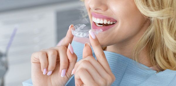An Attractive Young Woman Sporting A Mouthguard