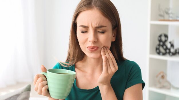 Woman Drinking Coffee Feeling Tooth Pain From Teeth Sensitivity.